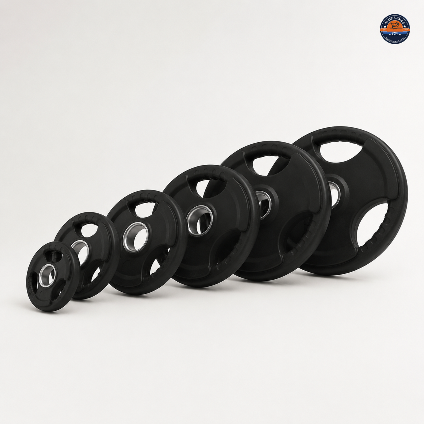 Pares de discos olímpicos de hierro con recubrimiento de hule disponibles de 2,5 a 25 kg por disco